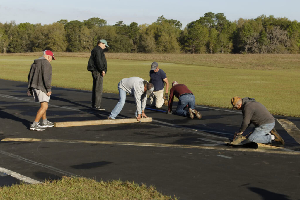 Club Members repairing runway at Tri-County Radio-Controlled Flying Club, Rainbow Air Park, Dunnellon, Florida